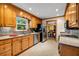 Well-lit kitchen with stainless steel appliances and view to the dining room at 441 Belgrave Ln, Tucker, GA 30084