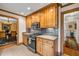 Cozy kitchen featuring tiled backsplash, stainless appliances, and view of the dining room at 441 Belgrave Ln, Tucker, GA 30084