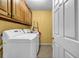 Functional laundry room with washer, dryer, and storage cabinets at 441 Belgrave Ln, Tucker, GA 30084