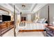 Spacious bedroom with a four poster bed and a lovely en-suite bathroom at 441 Belgrave Ln, Tucker, GA 30084