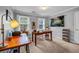 Home office with a large desk, natural light and ample room for work at 441 Belgrave Ln, Tucker, GA 30084