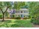 Charming two-story home with a well-manicured lawn and colorful shutters at 218 Oakmoor Ct, Lawrenceville, GA 30043