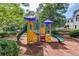 Community playground with slides and climbing structures at 218 Oakmoor Ct, Lawrenceville, GA 30043