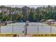 Community tennis courts with lush trees and shade at 218 Oakmoor Ct, Lawrenceville, GA 30043