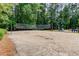 Community sand volleyball court with picnic benches at 218 Oakmoor Ct, Lawrenceville, GA 30043