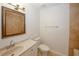Bathroom with a beige vanity, large mirror, and neutral tile flooring at 3101 Reeves Se St, Smyrna, GA 30080