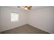 Cozy bedroom with neutral carpet, ceiling fan, and a window providing natural light at 3101 Reeves Se St, Smyrna, GA 30080