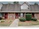 Charming brick townhome with well-maintained landscaping and a welcoming entrance at 3101 Reeves Se St, Smyrna, GA 30080