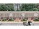 Aerial view of townhomes with parking, trees, and red doors at 3101 Reeves Se St, Smyrna, GA 30080