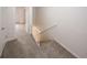 Carpeted hallway featuring the top of a staircase and entry to another room at 3101 Reeves Se St, Smyrna, GA 30080