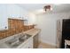 Galley kitchen with stainless steel appliances, and tan tile backsplash at 3101 Reeves Se St, Smyrna, GA 30080