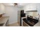 Galley kitchen with stainless steel appliances, and tan tile backsplash at 3101 Reeves Se St, Smyrna, GA 30080