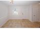 Bright living space boasts tile floors, fresh paint, a window and an exterior door at 3101 Reeves Se St, Smyrna, GA 30080