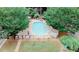 Aerial view of fenced pool, shed, chairs and tables in a common area at 3101 Reeves Se St, Smyrna, GA 30080