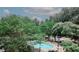 Common area fenced pool with chairs, tables and grill surrounded by trees and landscaping at 3101 Reeves Se St, Smyrna, GA 30080