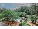 A common area fenced pool with chairs, tables and grill surrounded by trees and some landscaping at 3101 Reeves Se St, Smyrna, GA 30080