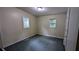 Bedroom with two windows and neutral paint, ready for your personal touch at 5177 Mccarter Sta, Stone Mountain, GA 30088