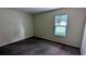 Light-filled bedroom with a window, offering a simple design for customization at 5177 Mccarter Sta, Stone Mountain, GA 30088