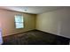 Bedroom with a window offering natural light and ample closet space at 5177 Mccarter Sta, Stone Mountain, GA 30088