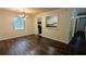 Dining area with hardwood floors, a chandelier, and an open view into the kitchen at 5177 Mccarter Sta, Stone Mountain, GA 30088