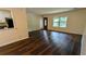 Bright living area with hardwood floors, a front door entrance, and lots of natural light at 5177 Mccarter Sta, Stone Mountain, GA 30088