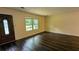 Inviting living room with hardwood floors, neutral walls, and ample natural light at 5177 Mccarter Sta, Stone Mountain, GA 30088