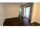 Versatile room with hardwood floors, neutral walls, and sliding door access at 5177 Mccarter Sta, Stone Mountain, GA 30088