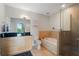 Modern bathroom with a soaking tub, separate shower, and a vanity with black countertop at 905 Juniper Ne St # 701, Atlanta, GA 30309