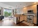 Bright living room with hardwood floors and large window providing natural light and views at 905 Juniper Ne St # 701, Atlanta, GA 30309