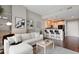 Comfortable living room with open layout, leading to the kitchen and featuring sleek hardwood floors at 905 Juniper Ne St # 701, Atlanta, GA 30309