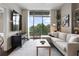 Comfortable living area with large windows showcasing outdoor scenery and stylish furnishings at 905 Juniper Ne St # 701, Atlanta, GA 30309