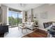 Cozy living room featuring large window, modern decor, and comfortable seating at 905 Juniper Ne St # 701, Atlanta, GA 30309