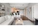 Spacious living room featuring hardwood floors, open layout to the kitchen and stylish modern decor at 905 Juniper Ne St # 701, Atlanta, GA 30309