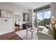 Bright living room open to bedroom, featuring large windows with natural light and sleek furnishings at 905 Juniper Ne St # 701, Atlanta, GA 30309