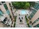 Aerial view of a condo complex, showcasing a luxurious pool, lounge area, and well-manicured greenery at 905 Juniper Ne St # 701, Atlanta, GA 30309