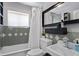 Classic bathroom features a tub, shower, and white fixtures, creating a clean, functional space at 1300 North Ne Ave, Atlanta, GA 30307