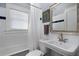 Well-lit bathroom featuring tiled walls and a shower-tub combo at 1300 North Ne Ave, Atlanta, GA 30307