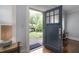 Entryway featuring hardwood floors, blue front door, and view of the front yard at 1300 North Ne Ave, Atlanta, GA 30307