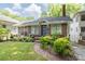 Charming brick home with landscaped front yard, walkway, and blue front door at 1300 North Ne Ave, Atlanta, GA 30307