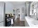 Efficient kitchen with stainless steel appliances and tiled floors at 1300 North Ne Ave, Atlanta, GA 30307