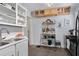 Efficient kitchen with white cabinets, modern appliances, and functional storage maximizing space at 1300 North Ne Ave, Atlanta, GA 30307