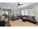 Bright living room with large windows, hardwood floors, and comfortable gray sofas at 1300 North Ne Ave, Atlanta, GA 30307