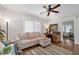 Comfortable living room with a couch, wood floors, and ceiling fan at 1300 North Ne Ave, Atlanta, GA 30307
