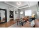 Living room with cozy leather furniture and wood floors at 1300 North Ne Ave, Atlanta, GA 30307