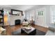 Bright living room with fireplace, hardwood floors, and comfortable seating at 1300 North Ne Ave, Atlanta, GA 30307
