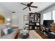 Cozy living room features a comfortable couch, area rug, ceiling fan, and bookcase for stylish, relaxed living at 1300 North Ne Ave, Atlanta, GA 30307