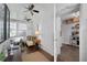 Inviting living space with two ceiling fans, lots of natural light, and an open layout to the kitchen at 1300 North Ne Ave, Atlanta, GA 30307