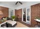 Charming brick patio with comfortable seating, ceiling fan, and stylish decor at 1300 North Ne Ave, Atlanta, GA 30307