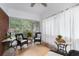 Screened-in porch with tile flooring, comfortable seating, and natural light at 1300 North Ne Ave, Atlanta, GA 30307