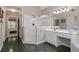 Bright bathroom with double vanity, a large tiled walk-in shower, and a jacuzzi tub at 1755 Noblin Summit Dr, Duluth, GA 30097